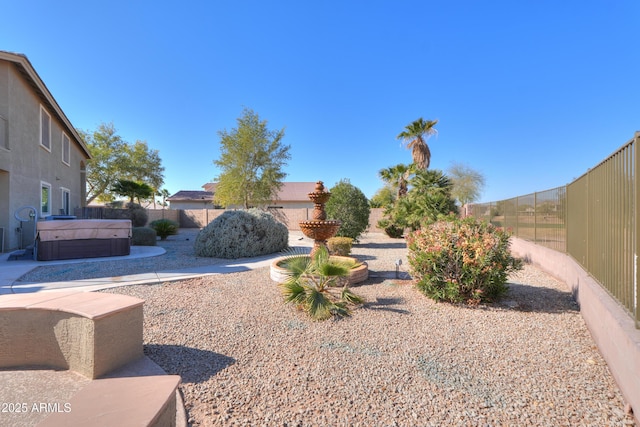 view of yard featuring a hot tub