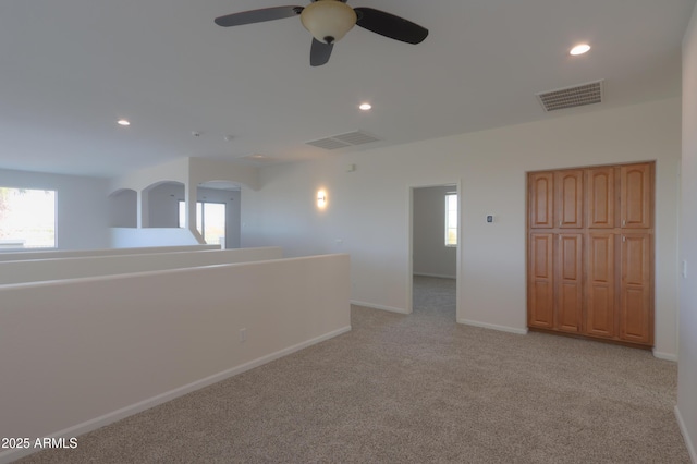 carpeted spare room with plenty of natural light