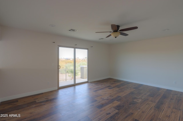 unfurnished room featuring ceiling fan and dark hardwood / wood-style floors