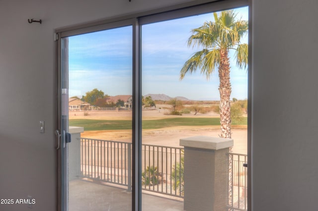 doorway to outside with a mountain view