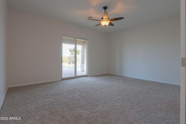 carpeted empty room featuring ceiling fan