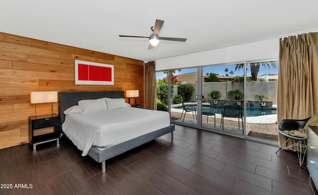 7806 E Via De La Entrada, Scottsdale, AZ 85258 - bedroom featuring wooden walls, access to outside, and ceiling fan
