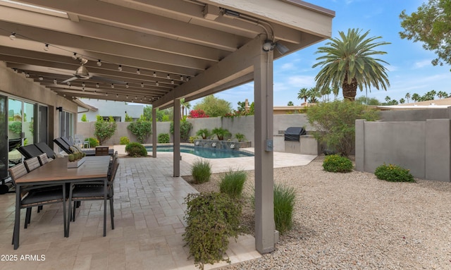 7806 E Via De La Entrada, Scottsdale, AZ 85258 - fenced backyard featuring exterior kitchen, a patio area, and outdoor dining space