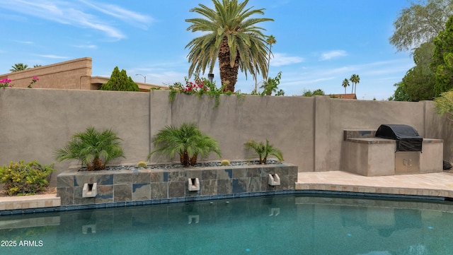 7806 E Via De La Entrada, Scottsdale, AZ 85258 - view of pool featuring exterior kitchen