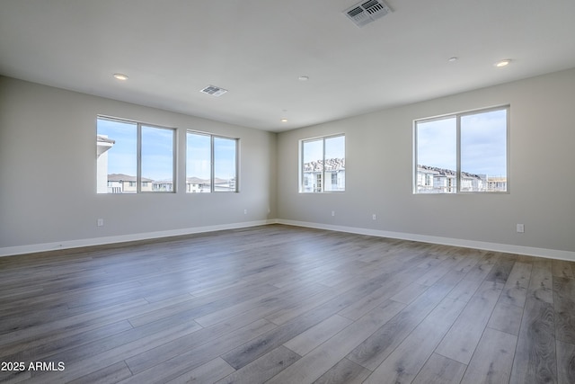 2121 W Sonoran Desert Dr Unit 43, Phoenix, AZ 85085 - empty room featuring wood finished floors, recessed lighting, and baseboards