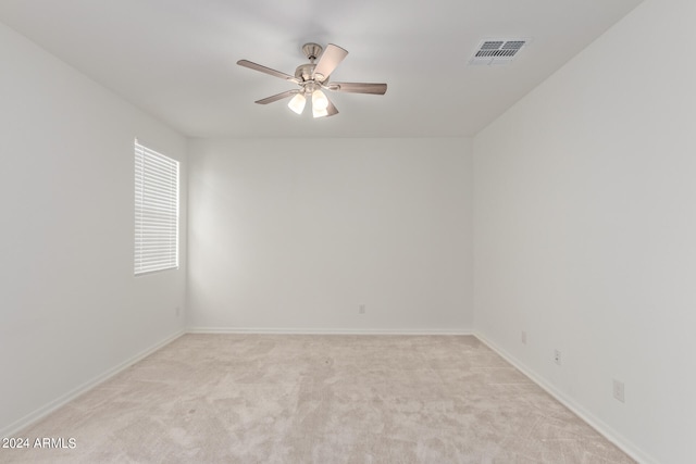 empty room with light carpet and ceiling fan