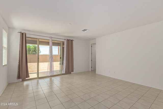 empty room with light tile patterned floors