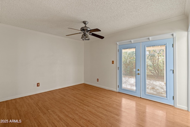 unfurnished room with french doors, ceiling fan, light hardwood / wood-style floors, and a textured ceiling