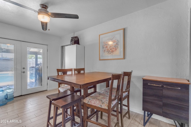 dining room with ceiling fan and french doors