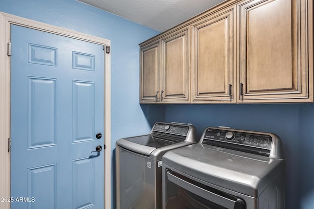 laundry area with cabinet space and washer and dryer
