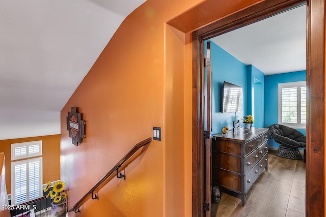 stairway with wood finished floors