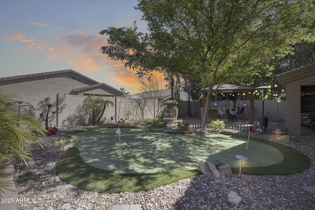 view of yard featuring a fenced backyard and a gazebo
