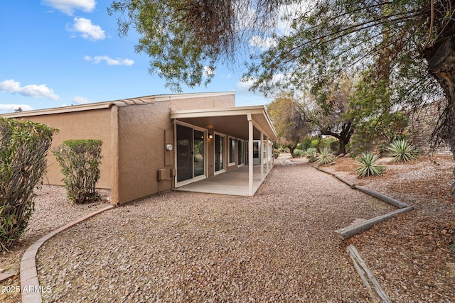 back of property with a patio area