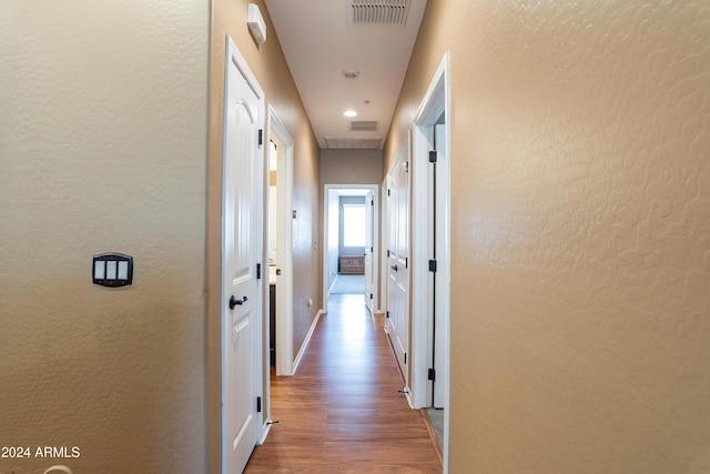 hallway featuring wood-type flooring