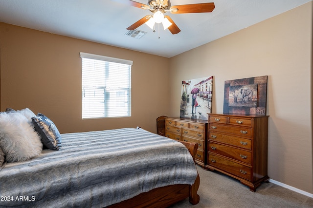 bedroom featuring ceiling fan and light colored carpet