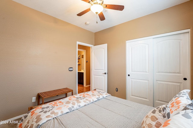 bedroom with ceiling fan and a closet