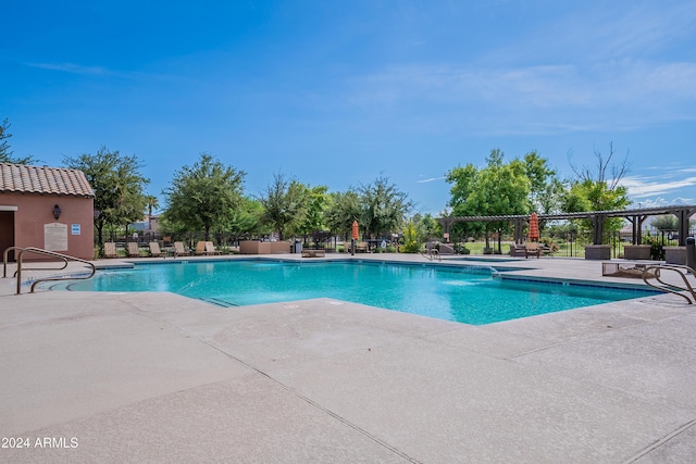 view of swimming pool with a patio area