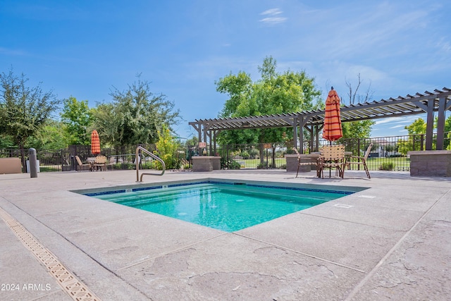 view of pool with a pergola and a patio