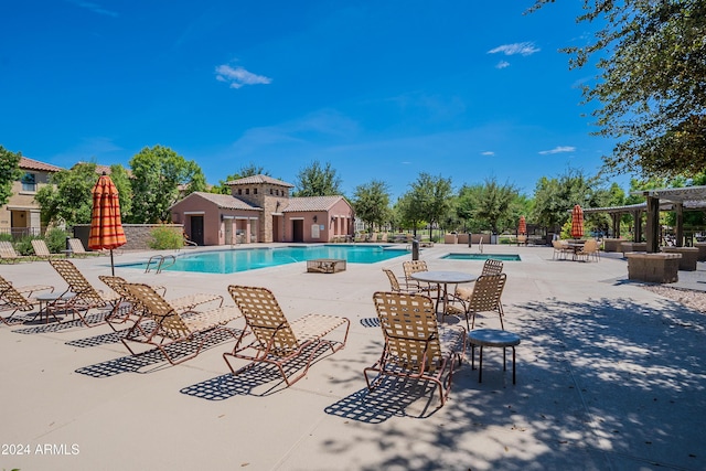 view of pool with a patio area and a pergola