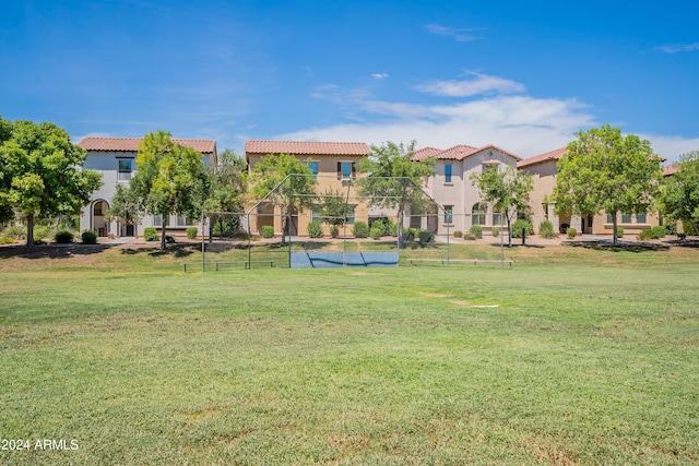 view of home's community with a lawn