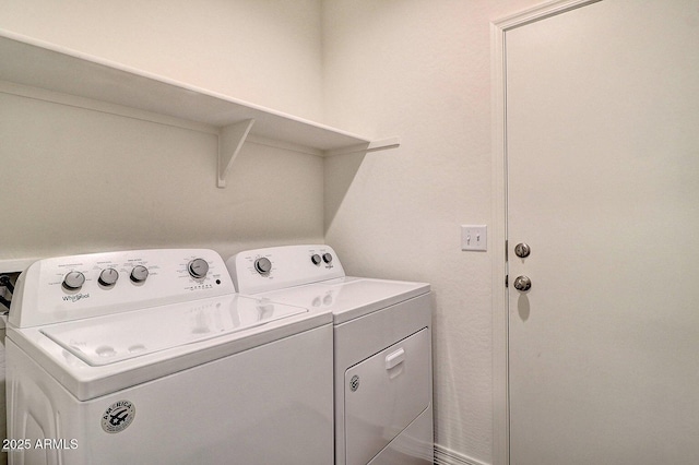 laundry room with washer and clothes dryer and laundry area