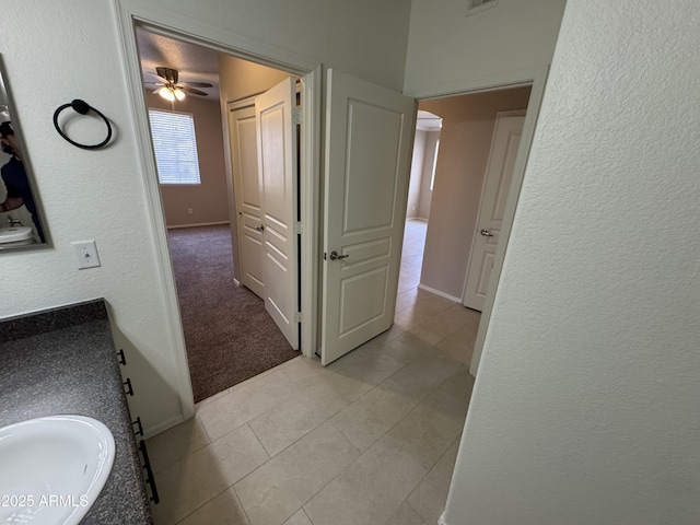 1941 S Pierpont Dr Unit 1043, Mesa, AZ 85206 - corridor with a sink and light tile patterned floors