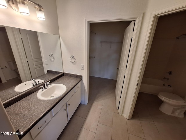 1941 S Pierpont Dr Unit 1043, Mesa, AZ 85206 - bathroom featuring vanity, tile patterned floors, a walk in closet, and shower / bathtub combination