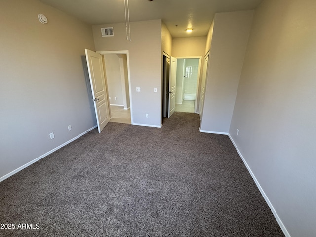 1941 S Pierpont Dr Unit 1043, Mesa, AZ 85206 - unfurnished bedroom featuring dark carpet and ensuite bath