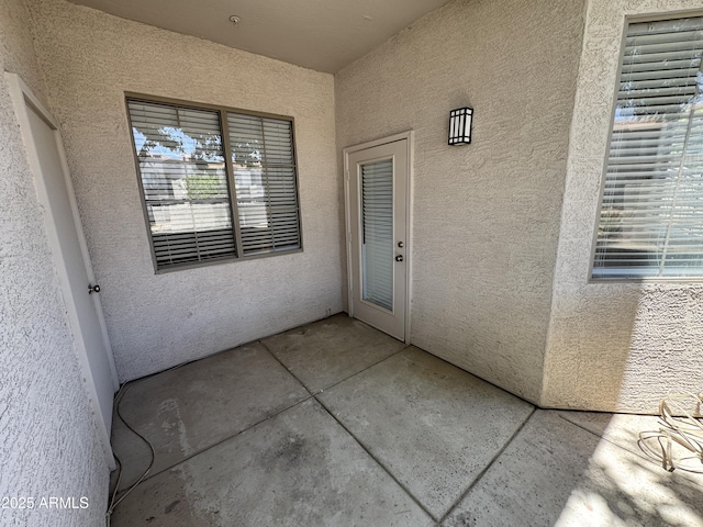1941 S Pierpont Dr Unit 1043, Mesa, AZ 85206 - view of exterior entry featuring stucco siding