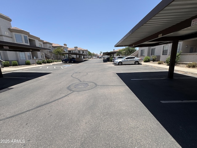 1941 S Pierpont Dr Unit 1043, Mesa, AZ 85206 - partially covered parking lot with a residential view