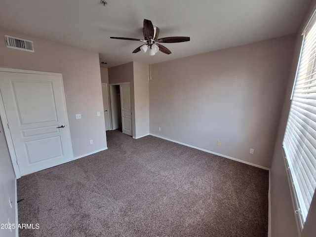 1941 S Pierpont Dr Unit 1043, Mesa, AZ 85206 - unfurnished bedroom featuring dark colored carpet and ceiling fan