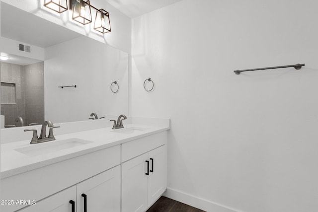 bathroom featuring vanity and wood-type flooring