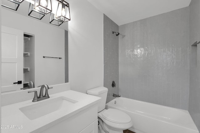 full bathroom with vanity, toilet, and tiled shower / bath