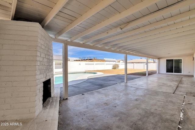 view of patio / terrace with a fenced in pool