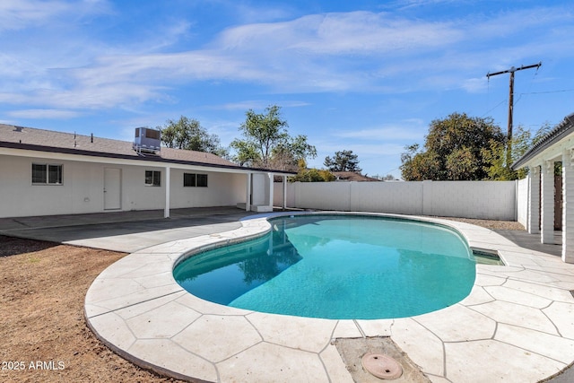 view of pool featuring a patio and central air condition unit