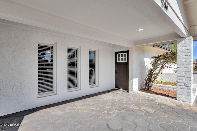 doorway to property featuring a patio area