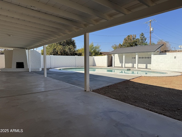 view of swimming pool with a patio