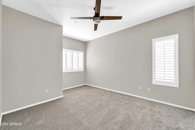 carpeted empty room with ceiling fan