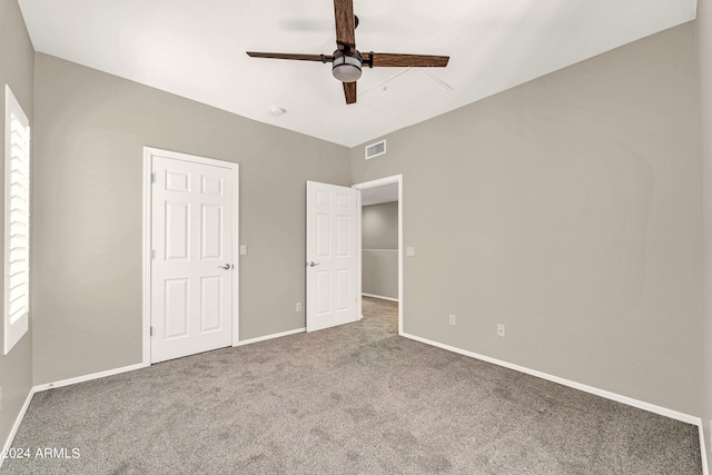 unfurnished bedroom with carpet floors and ceiling fan