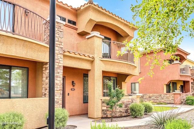 view of front of home with a balcony