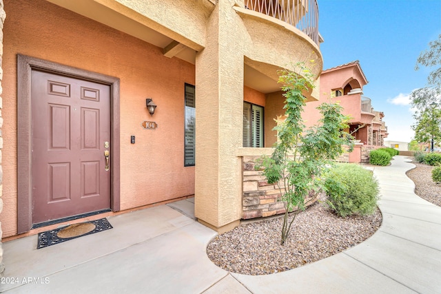 property entrance with a balcony