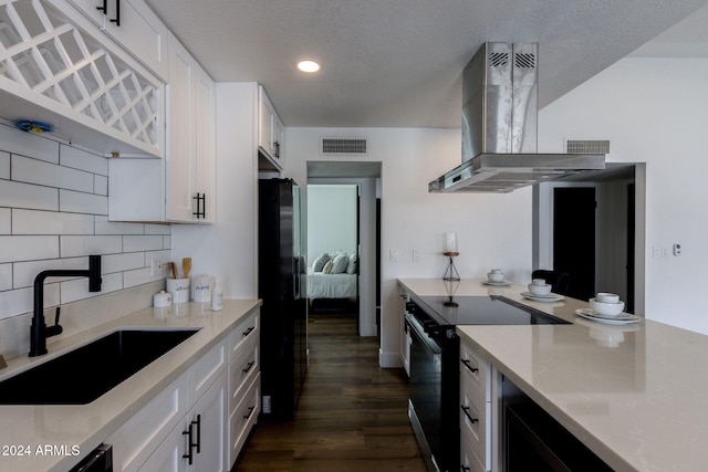 kitchen with sink, white cabinetry, range hood, and electric stove