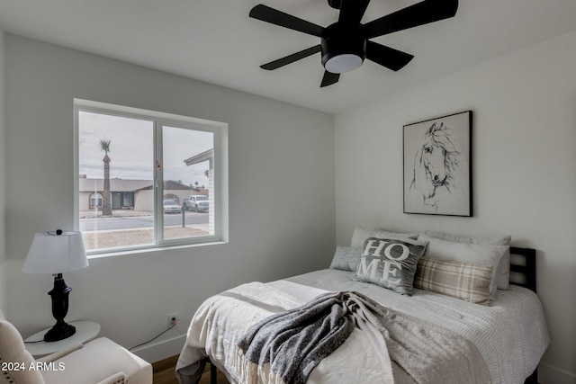 bedroom featuring hardwood / wood-style floors and ceiling fan