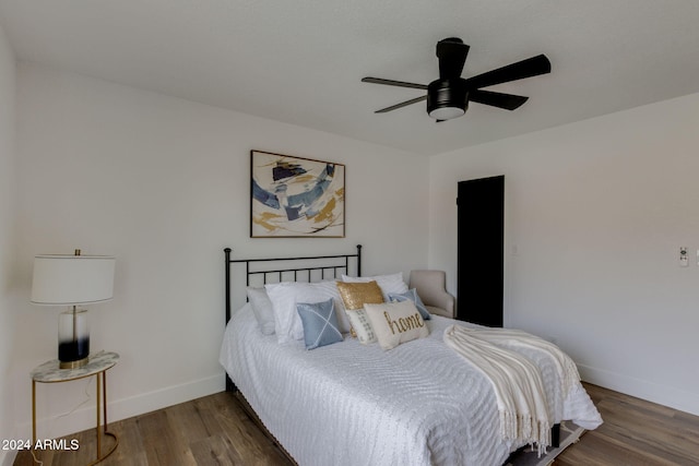 bedroom featuring hardwood / wood-style floors and ceiling fan