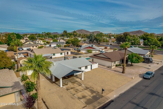 birds eye view of property featuring a mountain view