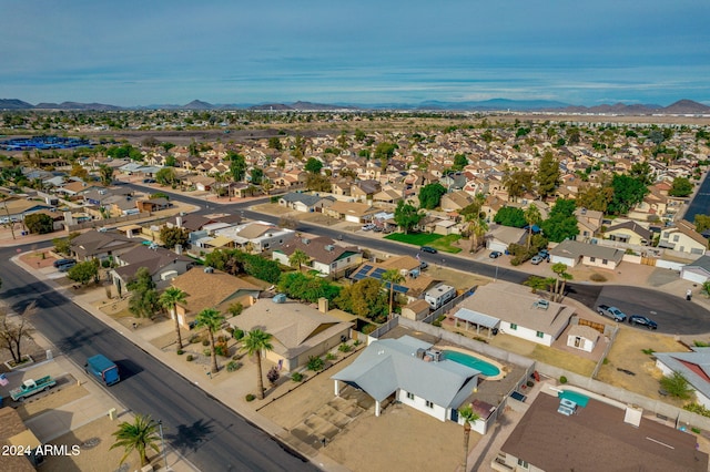 birds eye view of property with a mountain view