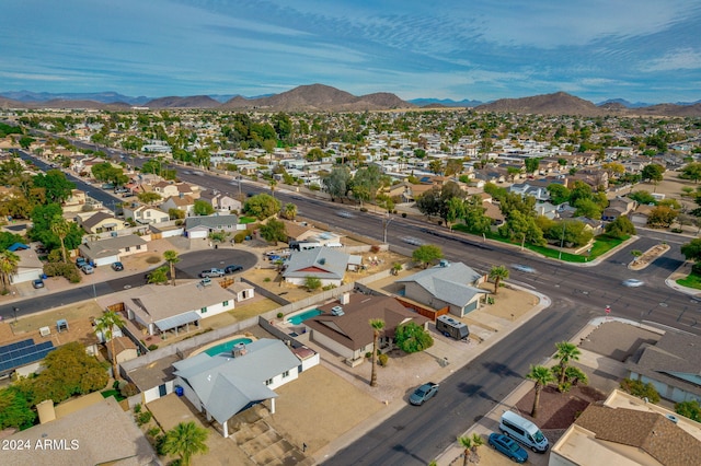 birds eye view of property with a mountain view