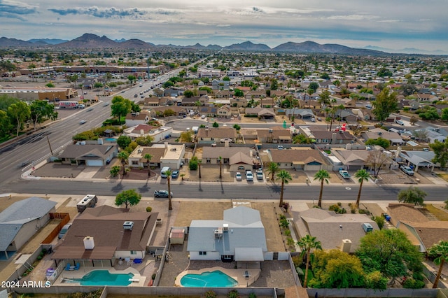 birds eye view of property with a mountain view