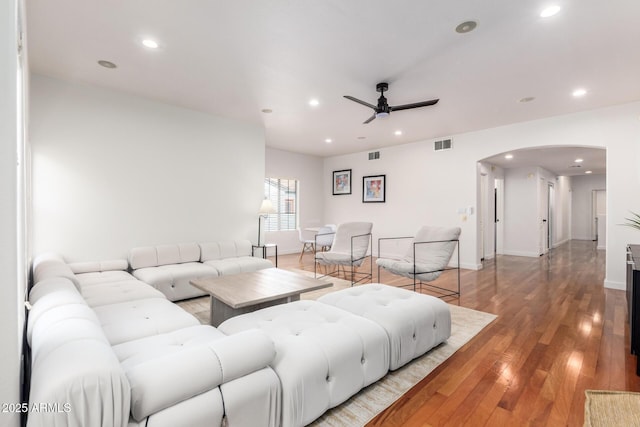 3150 E Beardsley Rd Unit 1081, Phoenix, AZ 85050 - living room featuring ceiling fan, arched walkways, recessed lighting, and light wood-style flooring