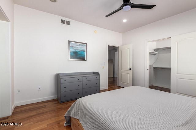 3150 E Beardsley Rd Unit 1081, Phoenix, AZ 85050 - bedroom featuring wood finished floors, recessed lighting, ceiling fan, and a walk in closet